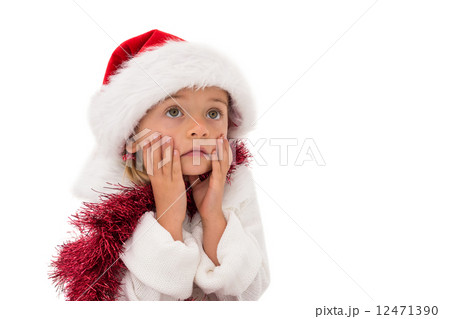 Cute little girl wearing santa hat and tinsel 12471390