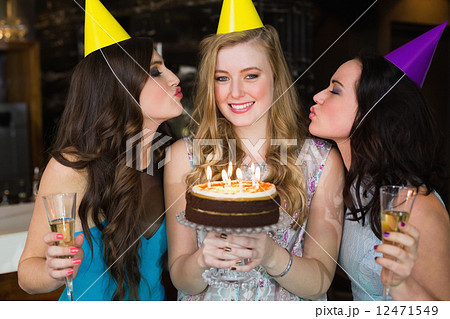 Attractive friends celebrating a birthday Attractive friends celebrating a birthday 12471549