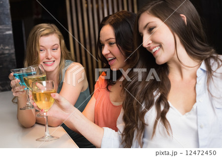 Pretty friends meeting up for a drink Pretty friends meeting up for a drink 12472450
