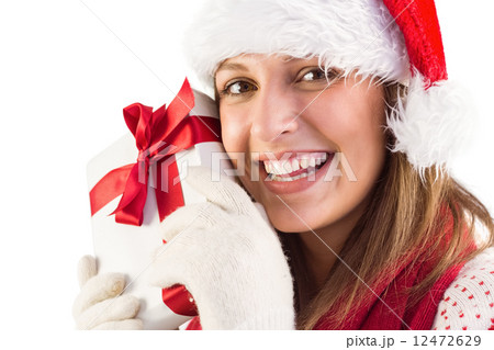 Portrait of smiling young woman holding gift Portrait of smiling young woman holding gift 12472629