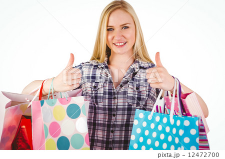 Pretty young blonde holding shopping bags Pretty young blonde holding shopping bags 12472700