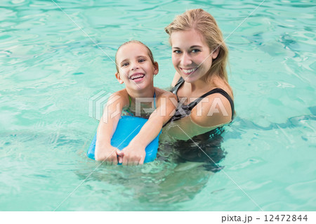 Happy mother and daughter in the swimming pool Happy mother and daughter in the swimming pool 12472844