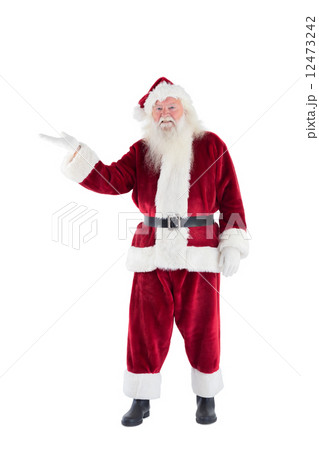 Santa shows something to camera 12473242