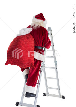 Santa steps up a ladder 12473502