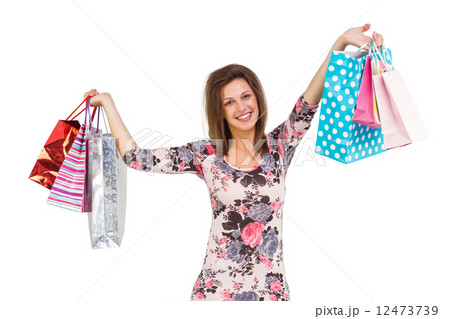 Woman standing with shopping bag 12473739