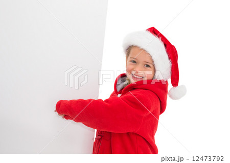 Festive little girl showing poster 12473792