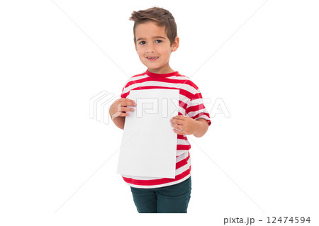 Cute little boy showing a page Cute little boy showing a page 12474594