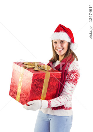 Young woman in stylish warm clothing holding a gift Young woman in stylish warm clothing holding a gift 12474614