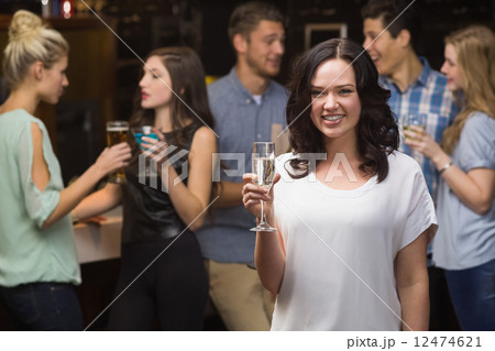 Pretty brunette having a glass of champagne Pretty brunette having a glass of champagne 12474621