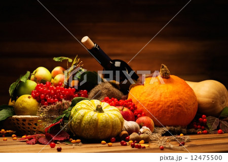 Thanksgiving day autumnal still life with bottle of wine Thanksgiving day autumnal still life with bottle of wine 12475500