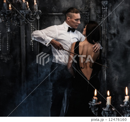 Woman with violin body art and man holding bow 12476160