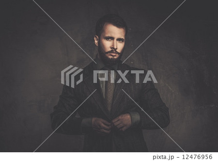 Handsome well-dressed man in jacket 12476956