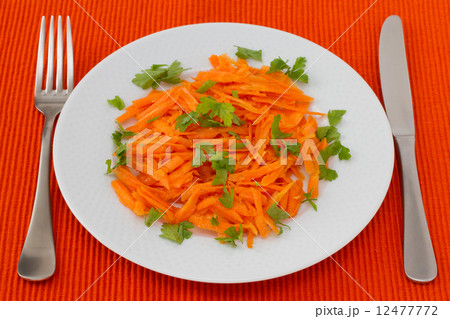 carrot salad with parsley on the white plate carrot salad with parsley on the white plate 12477772