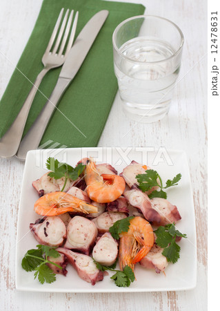 seafood salad with parsley on white plate seafood salad with parsley on white plate 12478631