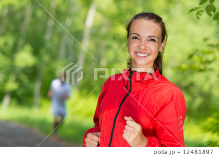 healthy young female athlete running 12481897