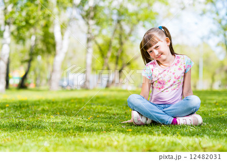 portrait of a smiling girl in a park portrait of a smiling girl in a park 12482031