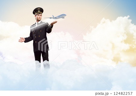 pilot in the form of extending a hand to airplane 12482257