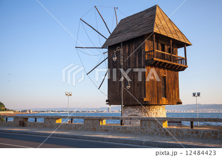 Old wooden windmill on the coast, the most popular landmark of o 12484423