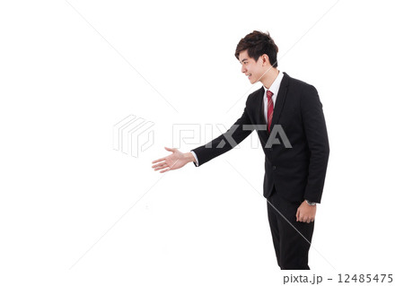 Asian executive extending a hand-shake 12485475