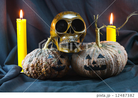 Human skulls and pumpkin on black background, Halloween day background. Human skulls and pumpkin on black background, Halloween day background. 12487382