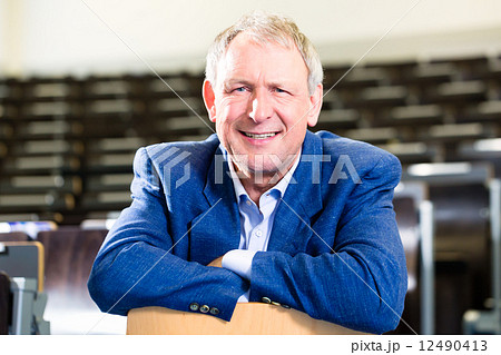 College professor in auditorium College professor in auditorium 12490413