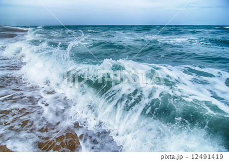 seascape with waves and sand beach 12491419