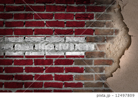 Dark brick wall with plaster - Latvia 12497809