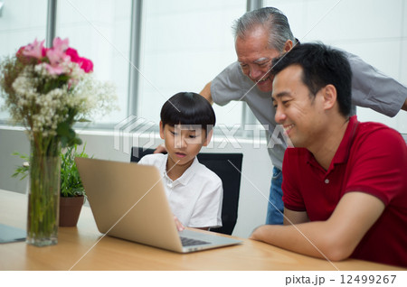 3 generation Asian family enjoying a bonding moment together at home 12499267