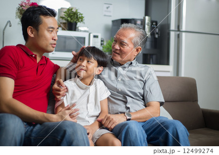 3 generation Asian family enjoying a bonding moment together at home 12499274