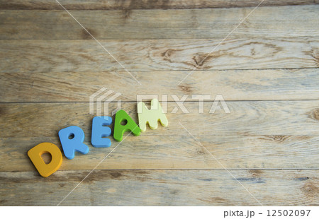 Colorful wooden word Dream on wooden floor Colorful wooden word Dream on wooden floor 12502097