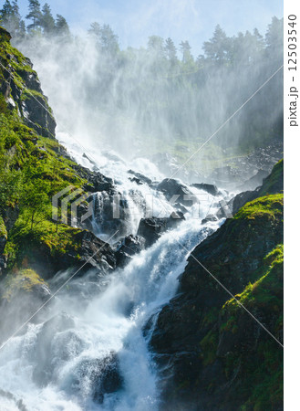 Summer Latefossen waterfall on mountain slope (Norway). 12503540