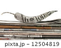 newspaper pepper on a stack of newspaper 12504819