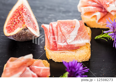 Slices of figs in Prosciutto Slices of figs in Prosciutto 12508273