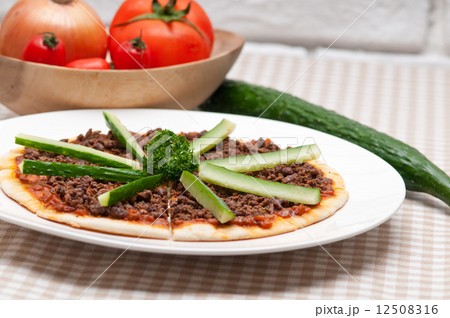Turkish beef pizza with cucumber on top 12508316