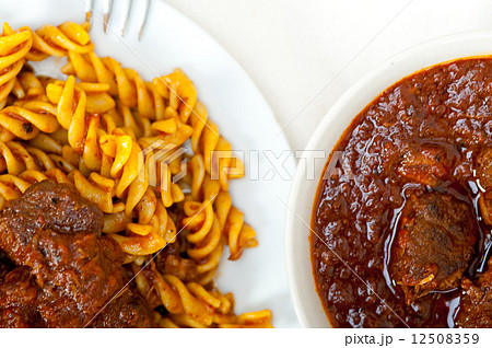 fusilli pasta with neapolitan style ragu meat sauce 12508359