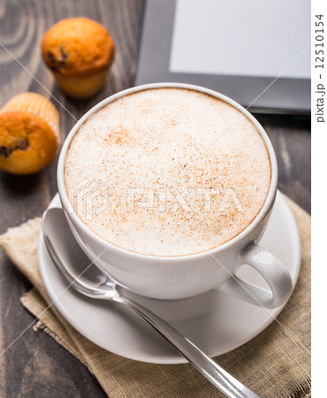 Cappuccino coffee with muffins 12510154