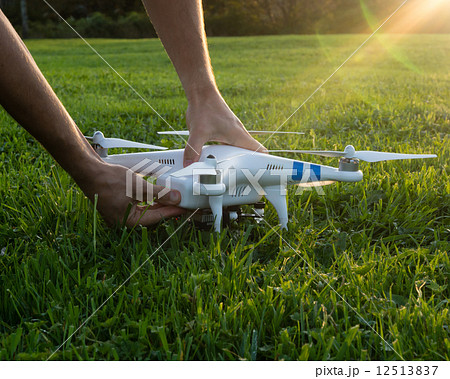 Man adjusting a camera drone 12513837