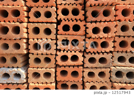 Stack of red bricks, bricks used for building construction Stack of red bricks, bricks used for building construction 12517943