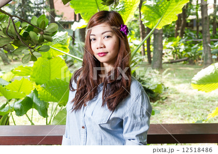 Filipina woman in a garden 12518486