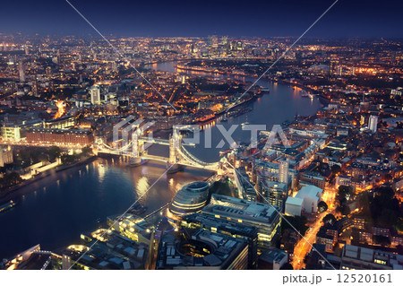 London at night with urban architectures and Tower Bridge 12520161