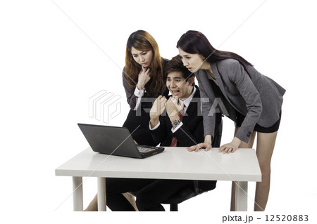 Shock reaction from the business team over what they read on computer  12520883