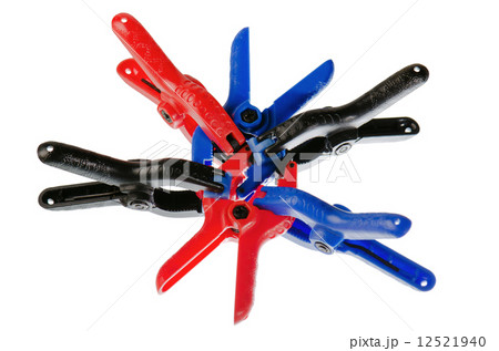 bonded between the colored clothespins, isolated on white 12521940