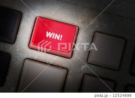 Red button on a dirty old panel 12524896