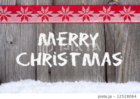 Christmas Greetings on old wooden Board Christmas Greetings on old wooden Board 12528064