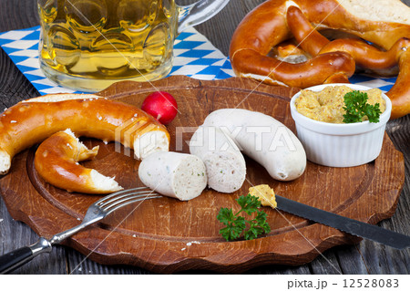 Veal sausage, pretzels and a glass of beer Veal sausage, pretzels and a glass of beer 12528083