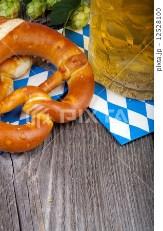 Glass of beer and pretzels 12528100
