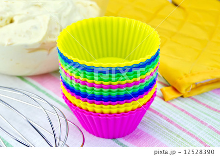 Molds for cupcakes with potholder mixer on fabric 12528390