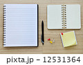 Blank notebook on the wood table - Top view 12531364