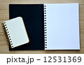 Two blank notebook on the wood table - Top view 12531369