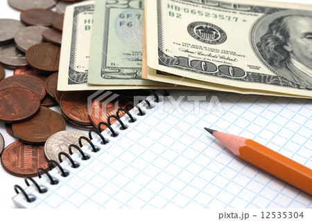 Coins, dollar bills, notebook and pencil. Coins, dollar bills, notebook and pencil. 12535304